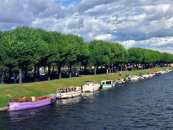 Scenic view of river against cloudy sky