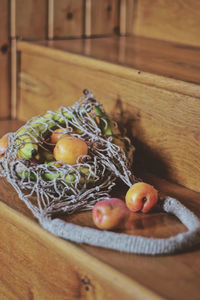 High angle view of fruits in basket on stairs