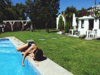 Man lying down in swimming pool