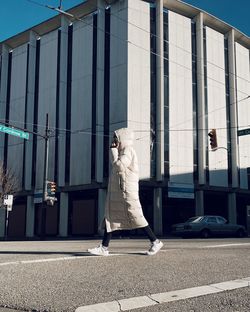 Statue against building in city