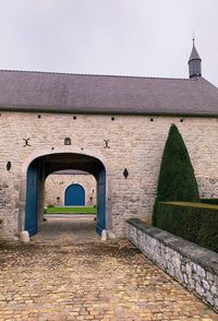 Entrance of historic building against clear sky