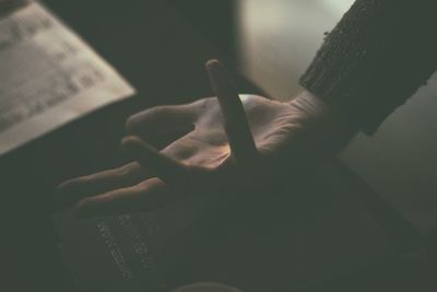 Close-up of hand holding book