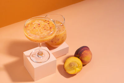 Close-up of orange juice on table