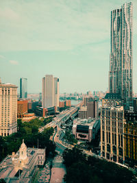 Modern buildings against sky in city