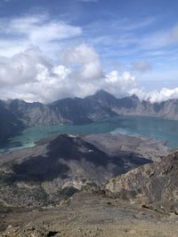 Scenic view of landscape and mountains against sky