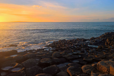 Scenic view of sea against sky during sunset