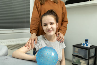 Portrait of cute baby boy sitting at home