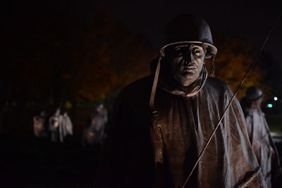 Full length of man with eyes closed at night