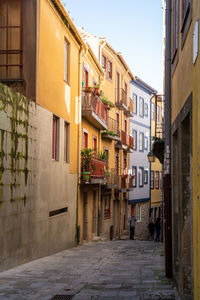 Narrow street amidst buildings in town