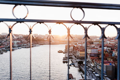 Railing on porto bridge at sunset, selective focus on city. travel, europe