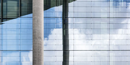 Full frame shot of modern glass building in city