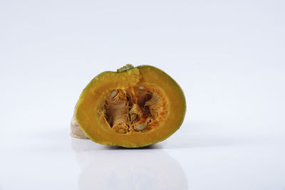 Close-up of fruit against white background