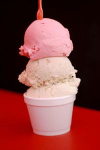 Close-up of ice cream cone against black background