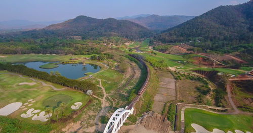 High angle view of rice paddy against mountains
