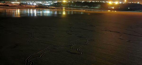 High angle view of wet river during sunset