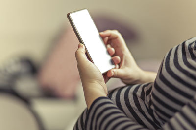 Close-up of woman using mobile phone