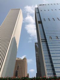 Low angle view of modern buildings against sky