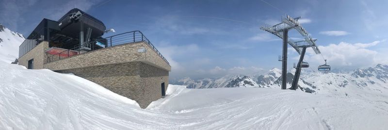 Low angle view of snow covered mountain against sky