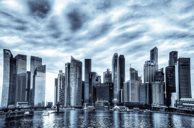 Panoramic view of buildings in city against sky