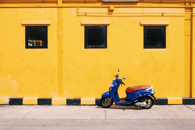 Vintage car on street against building