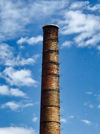 Low angle view of smoke stack against sky