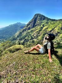 Full length of woman on mountains against sky