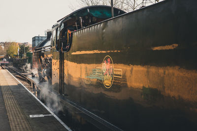 Train in city against sky