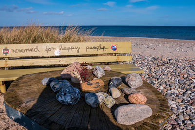 Pebbles on beach against sky