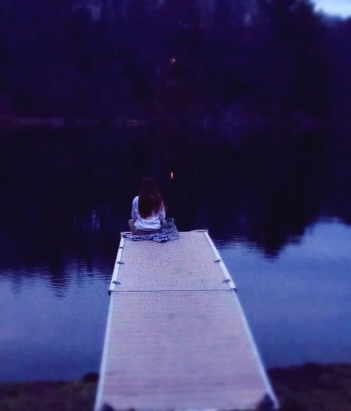 VIEW OF CALM LAKE WITH PIER