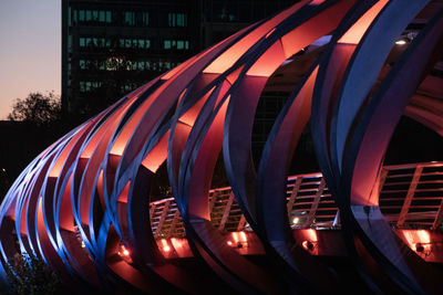 Close-up of illuminated modern building in city at night