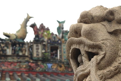 Close-up of statue against temple