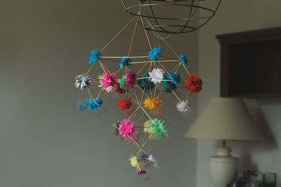 Low angle view of illuminated lanterns hanging on ceiling at home