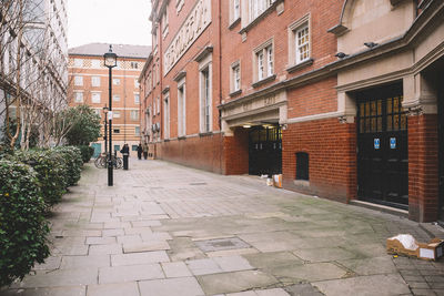 Buildings by street in city