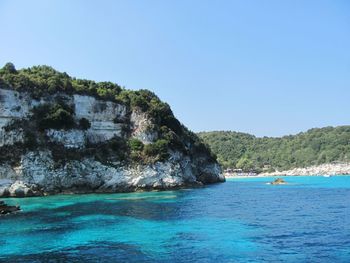 Scenic view of sea against clear blue sky