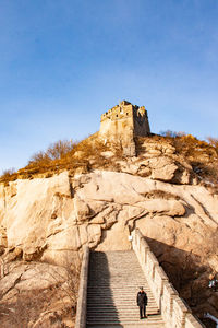 View of rock formation against clear blue sky