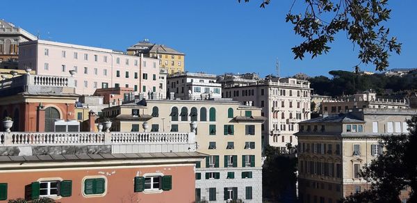 Low angle view of buildings against blue sky