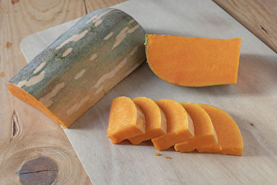 High angle view of orange slices on cutting board