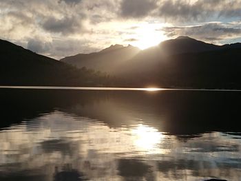 Scenic view of lake against sky during sunset