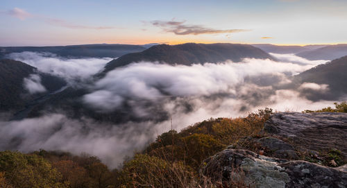 Scenic view of mountains against sky during sunset