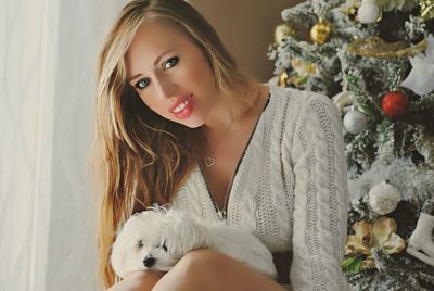 Portrait of young woman with teddy bear