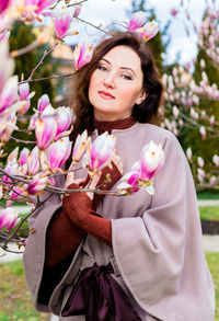 Portrait of young woman with flowers