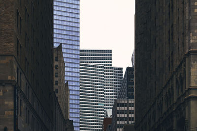 Low angle view of modern buildings against clear sky