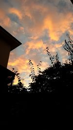 Low angle view of cloudy sky at sunset