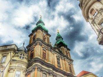 Low angle view of cathedral against cloudy sky