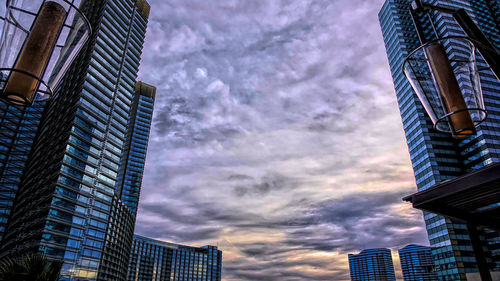 Low angle view of modern buildings against sky