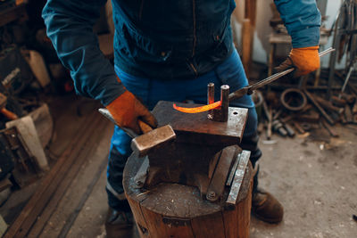 Low section of man working in workshop