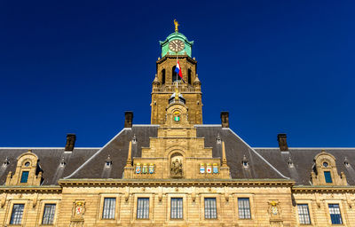 Low angle view of building against blue sky