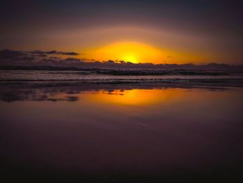 Scenic view of sea against romantic sky at sunset