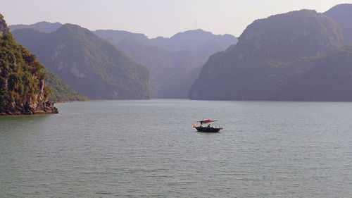 Boat at ha long bay against sky