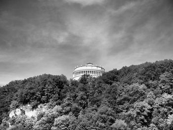 Low angle view of building against cloudy sky